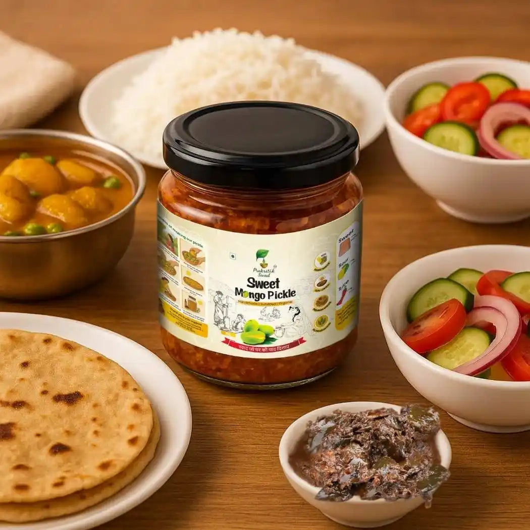 Jar of Sweet Mango Pickle on a wooden table with food items like rice, vegetables, and flatbreads.
