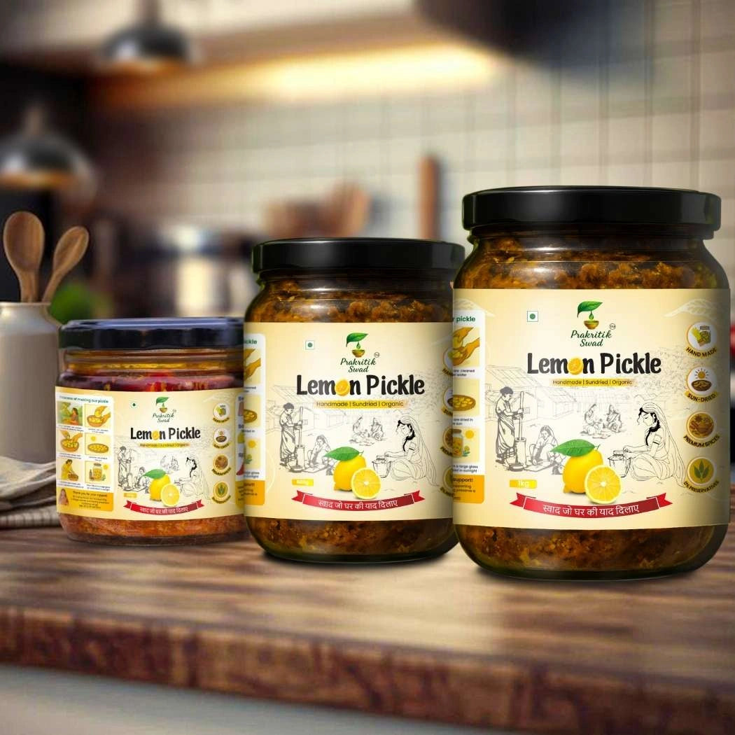 Three jars of Lemon Pickle on a wooden surface with a blurred kitchen background.