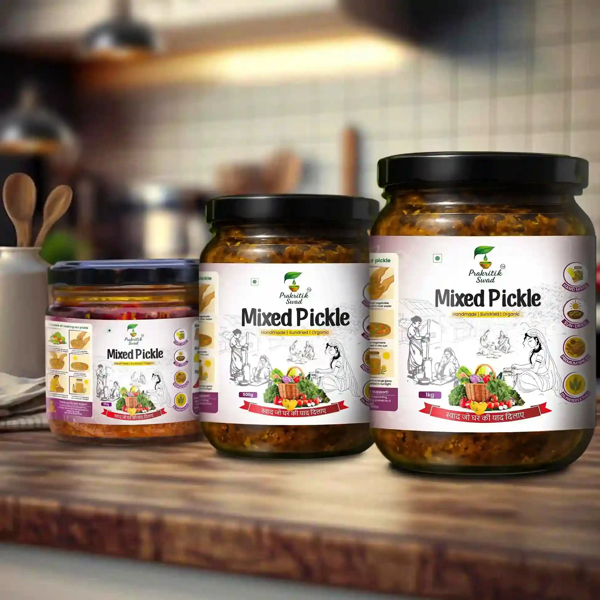 Three jars of mixed pickle on a wooden surface with a blurred kitchen background.