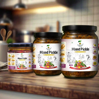 Three jars of mixed pickle on a wooden surface with a blurred kitchen background.